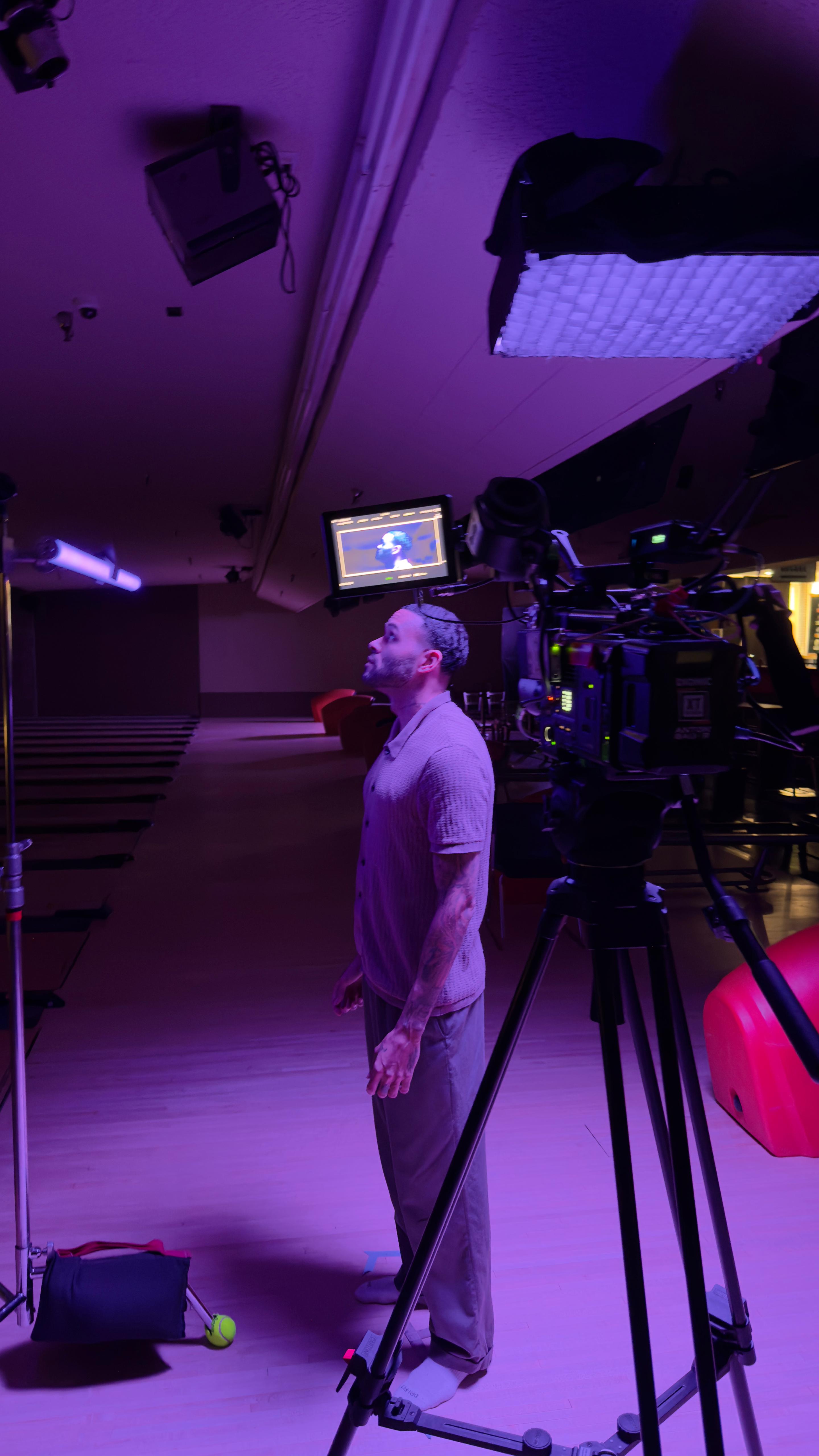 Actor on set with cinema camera and professional lighting - LA film production