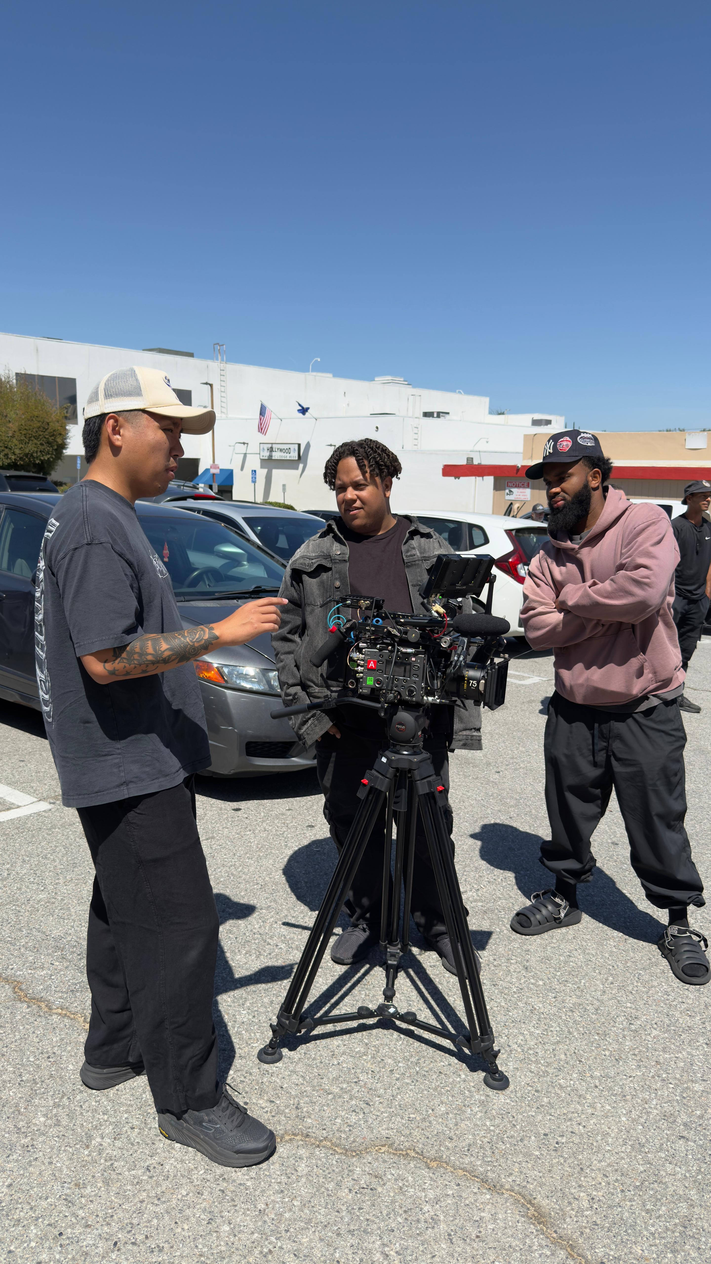 Professional film crew discussing shot setup - Los Angeles video production team